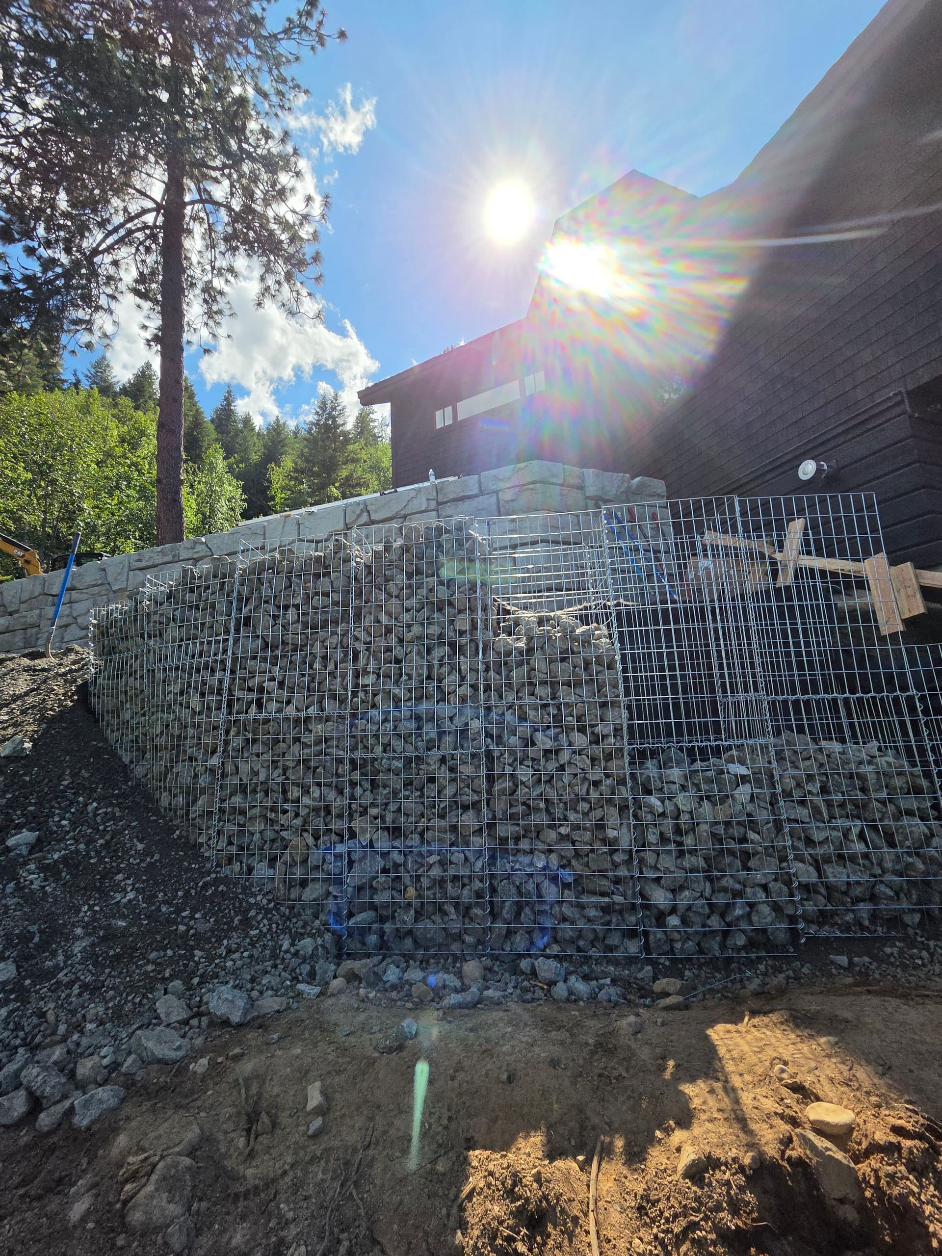 Gallery photos for Gabion Basket Retaining Wall Turns Steep Slope Into Usable Space: Image #1