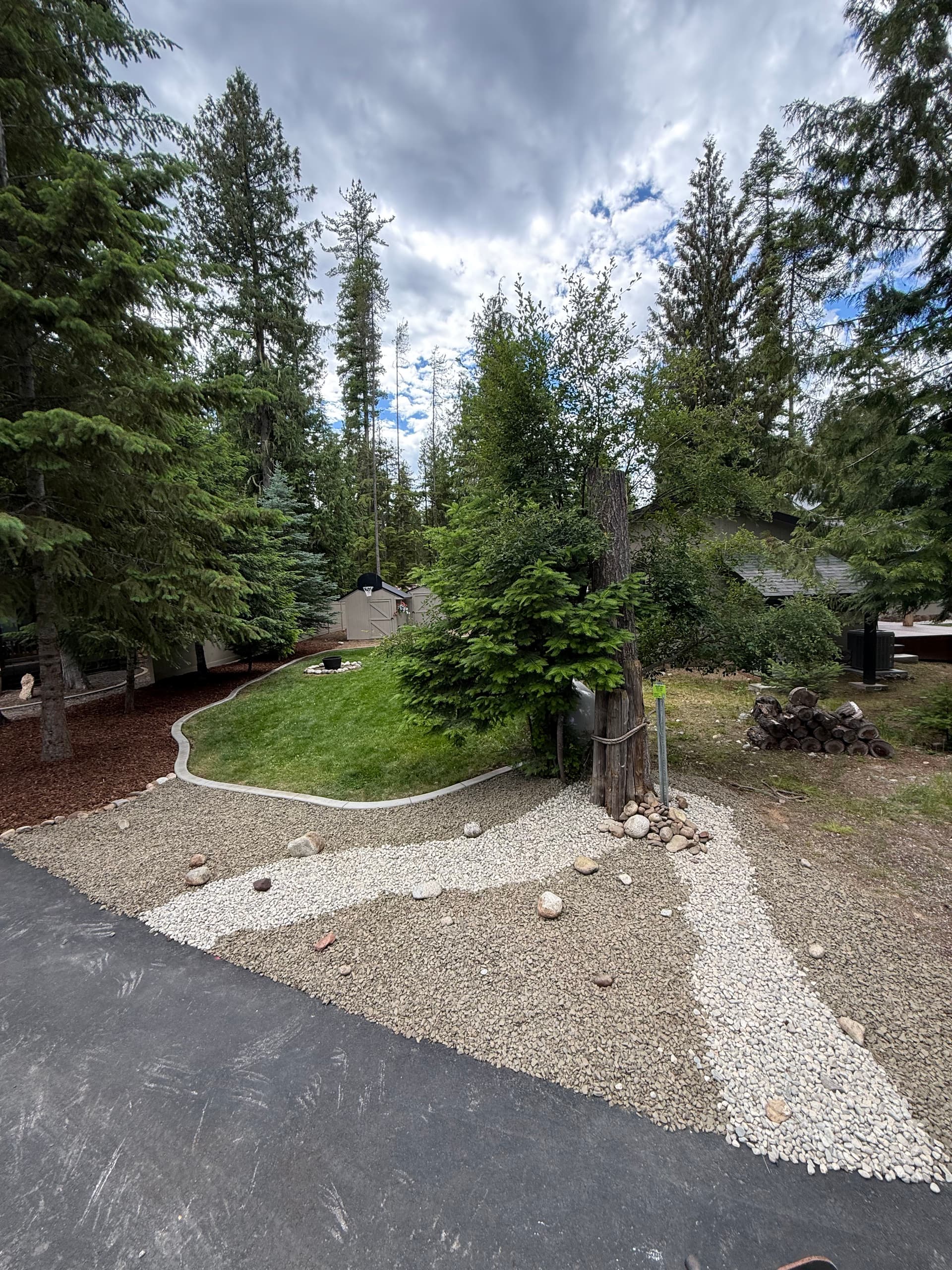Concrete Curbing, Rock Work, and Bark Mulch Done Right image