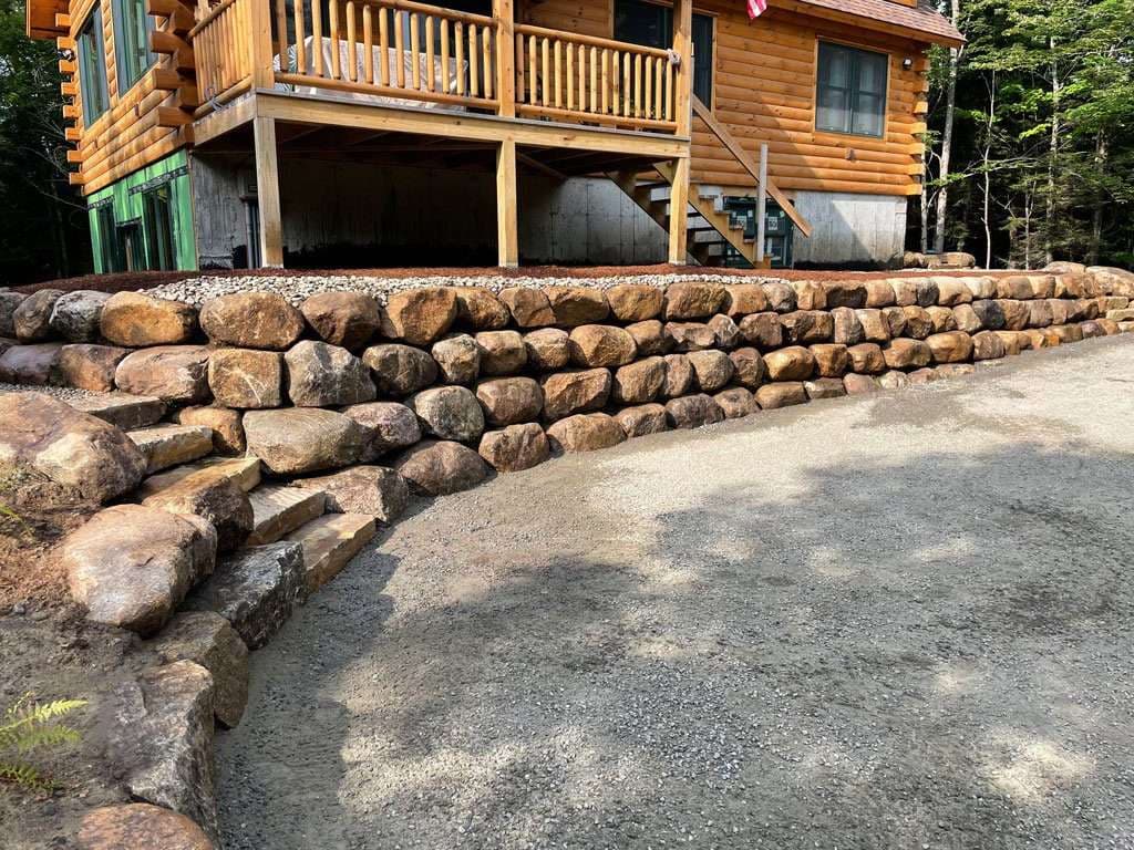 Gallery photos for Enhancing Outdoor Spaces with Boulder Walls and Concrete Curbing: Image #1